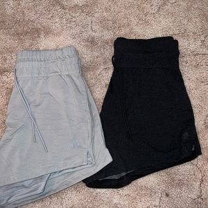 Pair of two adidas light & dark gray high waisted women’s shorts size medium